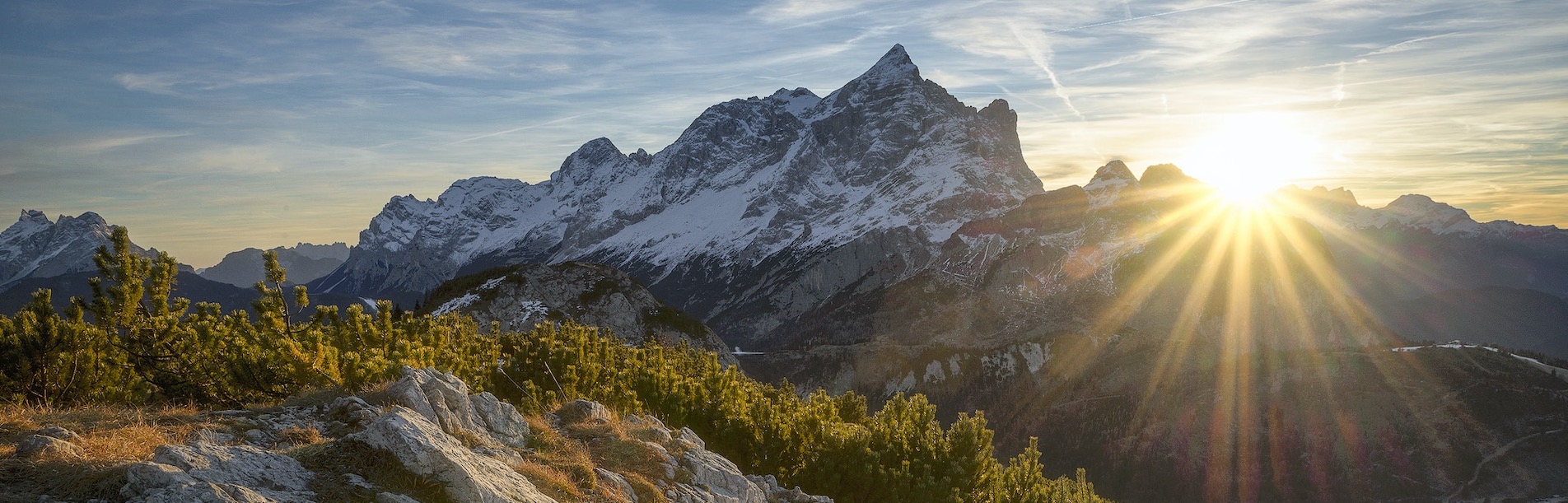 photo of mountain with sun